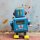 Roboter - kleiner Roboter mit Trommel - blau - Blechroboter