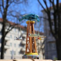 Tin toy carousel with propeller planes funfair tin carousel