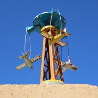 Tin toy carousel with propeller planes funfair tin carousel